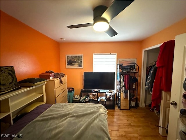 bedroom with ceiling fan and wood finished floors