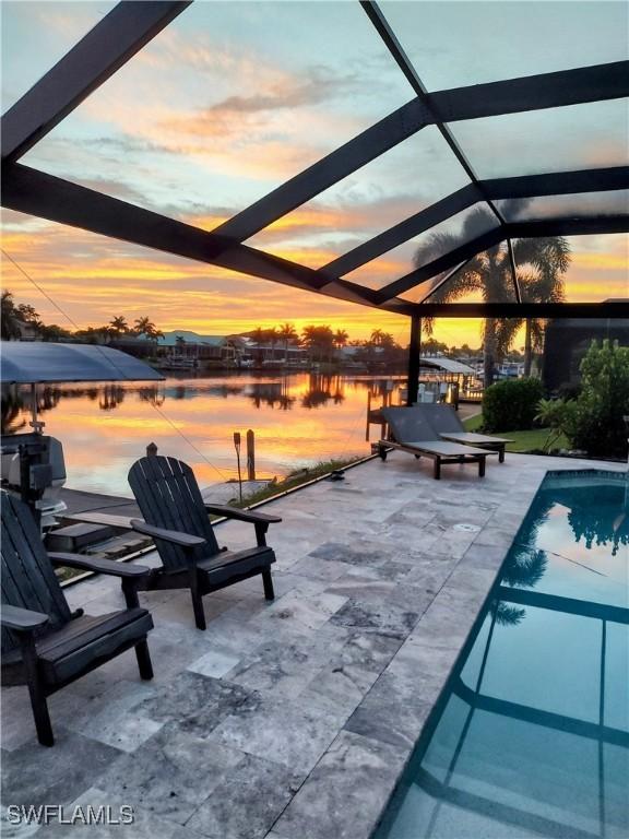 outdoor pool featuring a lanai and a patio area