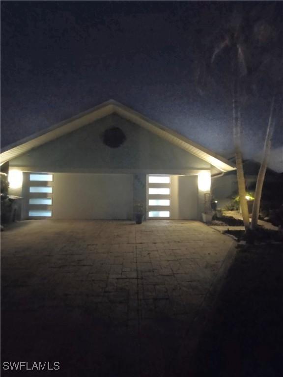 view of garage at night