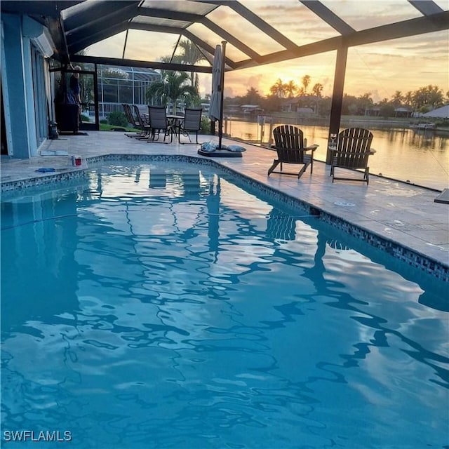 outdoor pool with a patio and a lanai