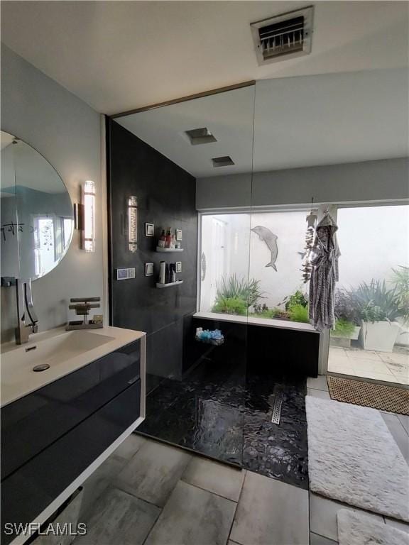 bathroom with visible vents and vanity