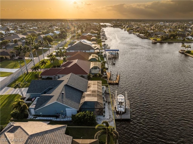 birds eye view of property featuring a residential view and a water view