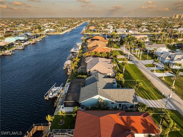 aerial view with a residential view and a water view