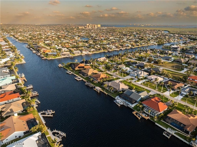 birds eye view of property with a residential view and a water view