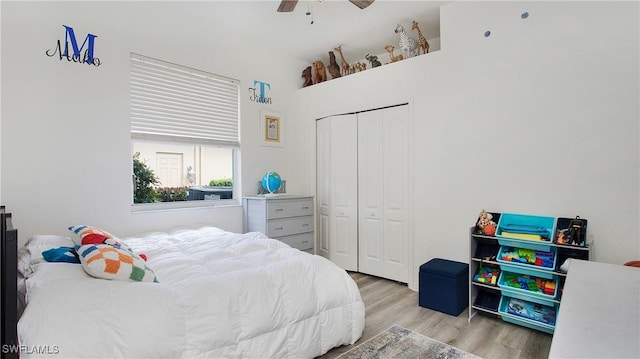 bedroom with a closet, a ceiling fan, and wood finished floors