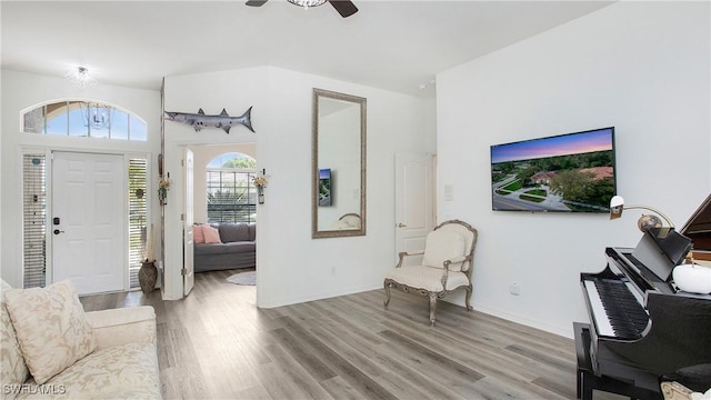 entryway featuring a ceiling fan, baseboards, and wood finished floors