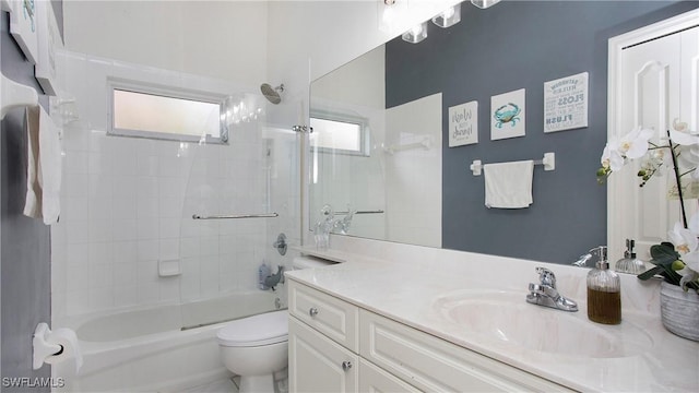 bathroom with shower / bath combination, vanity, and toilet