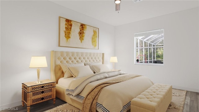 bedroom featuring ceiling fan, wood finished floors, and baseboards