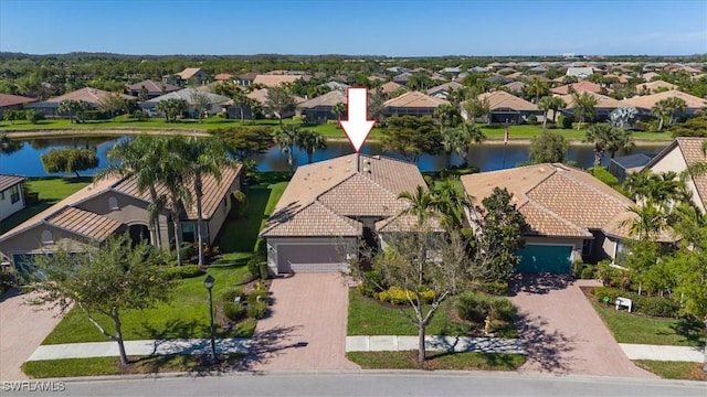 aerial view with a residential view and a water view