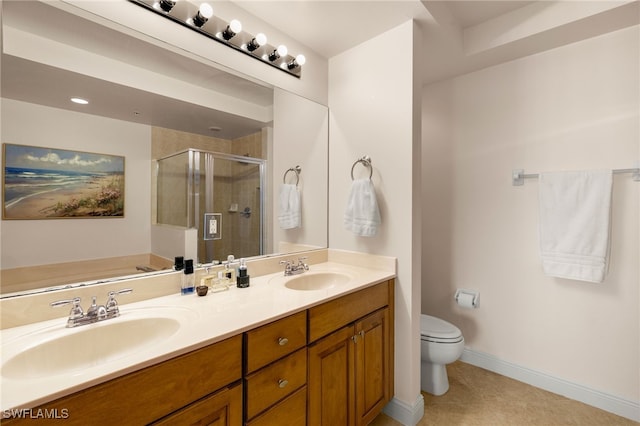 full bath with double vanity, a sink, toilet, and a shower stall