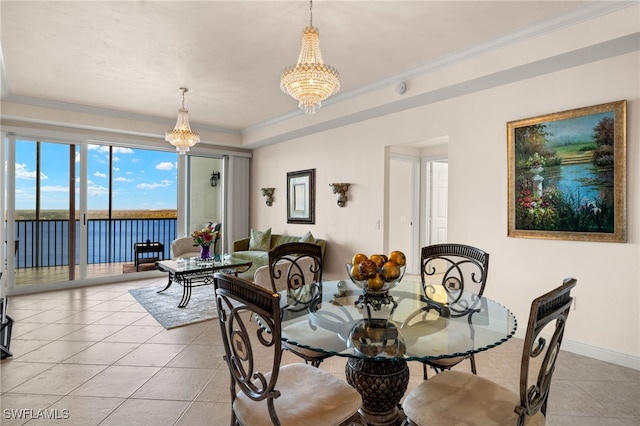 dining space with an inviting chandelier, baseboards, light tile patterned floors, and ornamental molding