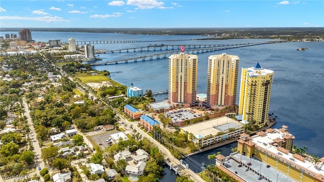 drone / aerial view with a view of city and a water view