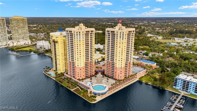 birds eye view of property featuring a view of city and a water view