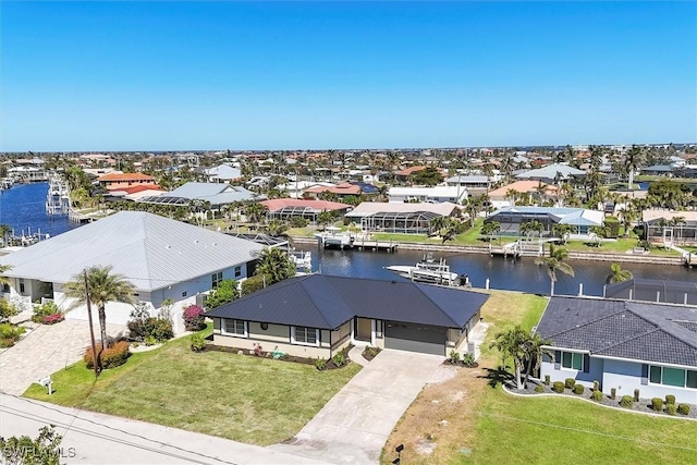 birds eye view of property featuring a residential view and a water view