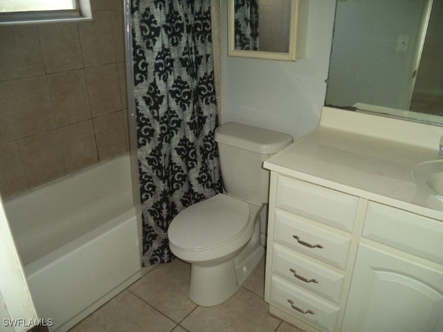 bathroom with toilet, tile patterned flooring, shower / tub combo with curtain, and vanity