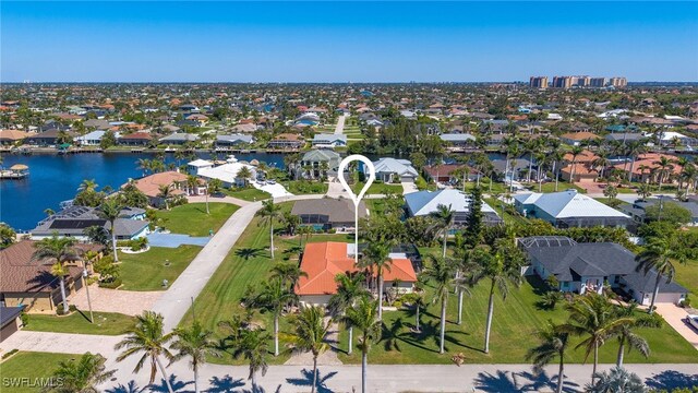 5305 SW 25th Ct, Cape Coral, FL 33914 - aerial view of property and surrounding area featuring nearby suburban area and a large body of water