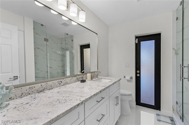 5305 SW 25th Ct, Cape Coral, FL 33914 - full bathroom featuring a marble finish shower, vanity, toilet, baseboards, and tile patterned flooring