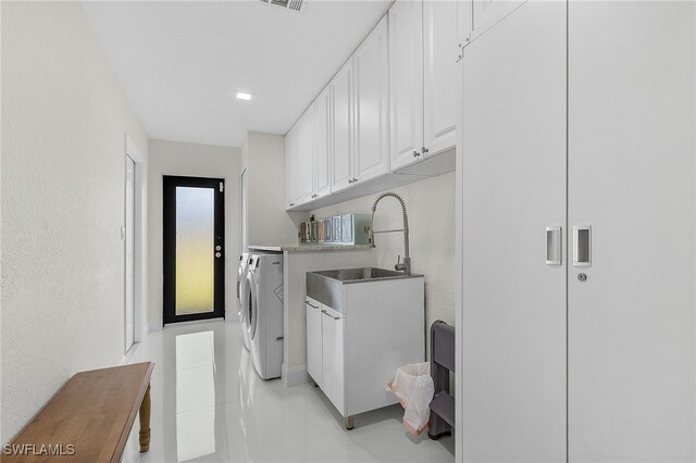 5305 SW 25th Ct, Cape Coral, FL 33914 - laundry room with independent washer and dryer, cabinet space, and light tile patterned floors