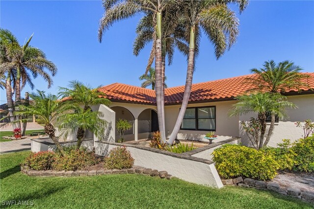 5305 SW 25th Ct, Cape Coral, FL 33914 - mediterranean / spanish-style home featuring stucco siding and a tiled roof