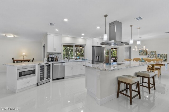 5305 SW 25th Ct, Cape Coral, FL 33914 - kitchen featuring stainless steel appliances, island range hood, wine cooler, a kitchen island, and white cabinets