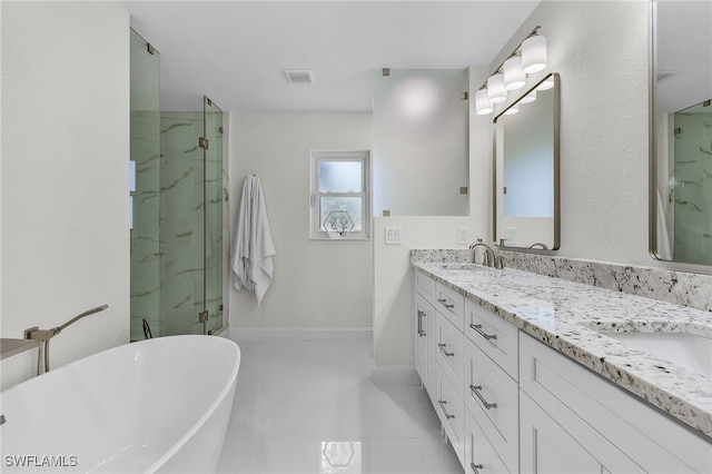 5305 SW 25th Ct, Cape Coral, FL 33914 - full bath featuring a soaking tub, a marble finish shower, double vanity, and tile patterned floors