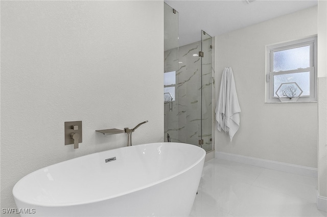 5305 SW 25th Ct, Cape Coral, FL 33914 - full bath with a marble finish shower, a freestanding bath, and baseboards