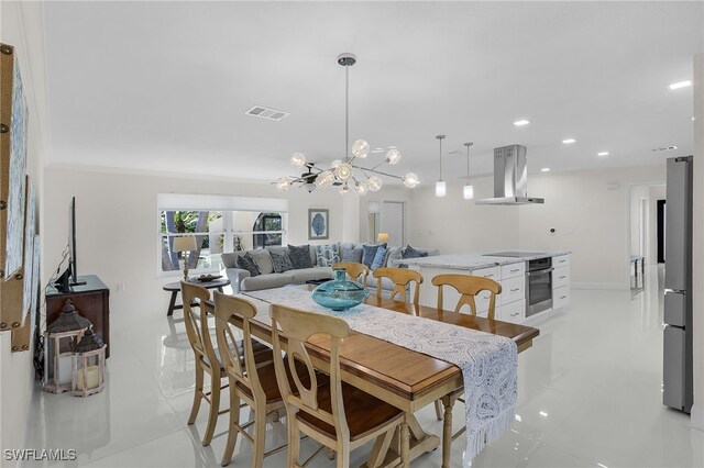 5305 SW 25th Ct, Cape Coral, FL 33914 - dining area featuring light tile patterned flooring, a chandelier, and recessed lighting