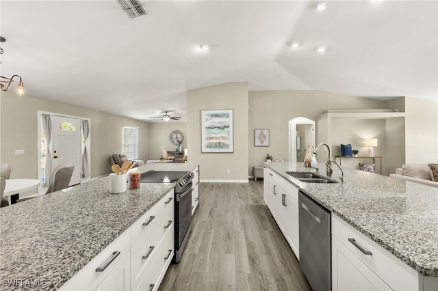 kitchen with visible vents, a sink, open floor plan, electric stove, and stainless steel dishwasher