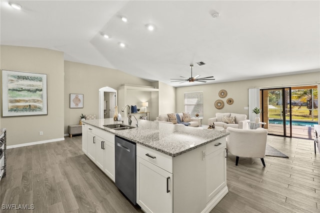 814 Louis Ave, Lehigh Acres, FL 33972 - kitchen with arched walkways, dishwasher, a sink, a ceiling fan, and a center island with sink