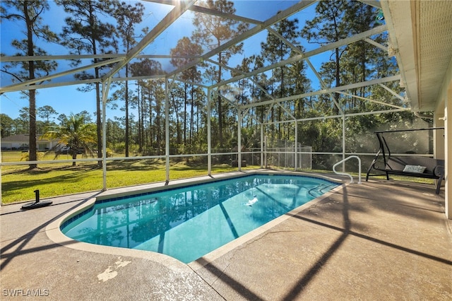 outdoor pool with a yard, a lanai, and a patio area