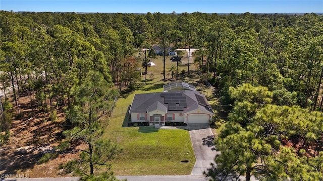 drone / aerial view with a view of trees