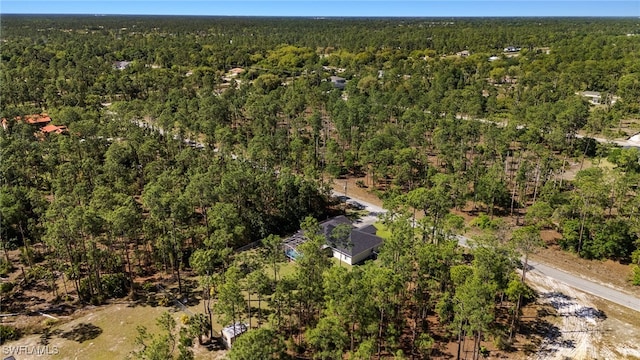 aerial view with a wooded view