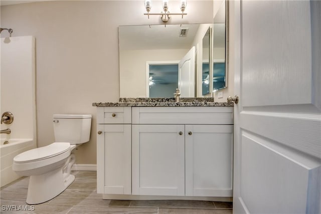 bathroom featuring shower / bath combination, visible vents, toilet, vanity, and baseboards