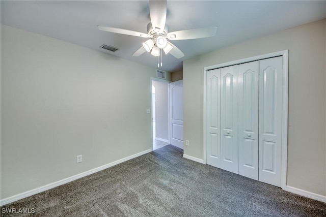 unfurnished bedroom with carpet floors, visible vents, and baseboards