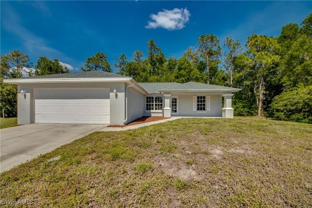 single story home with a front lawn, driveway, an attached garage, and stucco siding