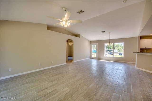 unfurnished living room with visible vents, baseboards, lofted ceiling, light wood-style flooring, and ceiling fan