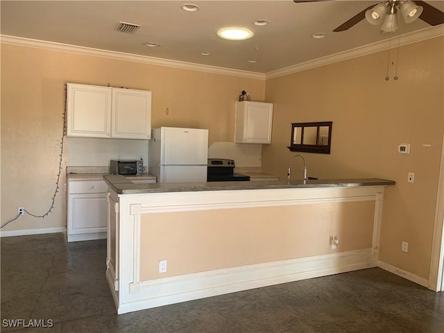 kitchen featuring ornamental molding, freestanding refrigerator, electric stove, and white cabinetry