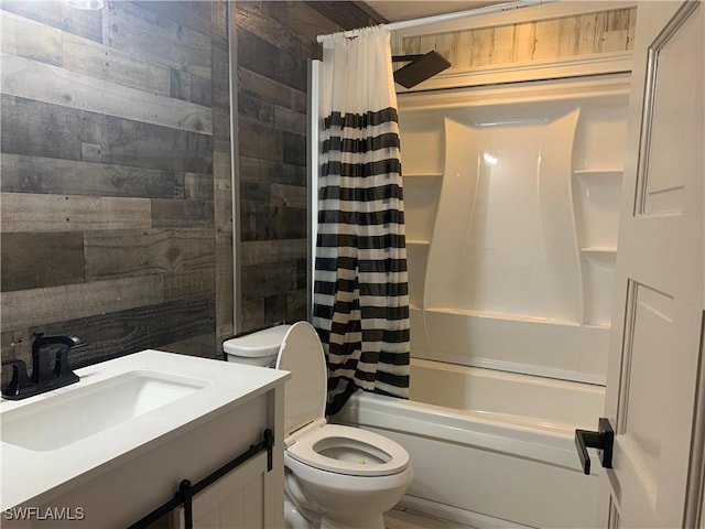 full bathroom featuring wood walls, vanity, toilet, and shower / bathtub combination with curtain