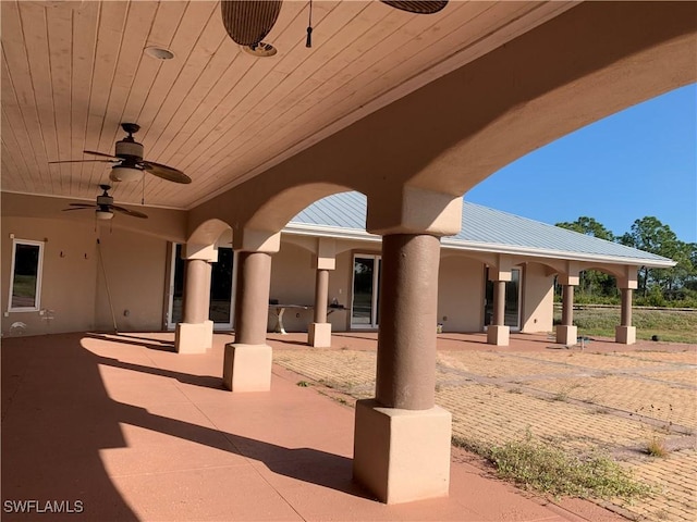 view of patio featuring ceiling fan