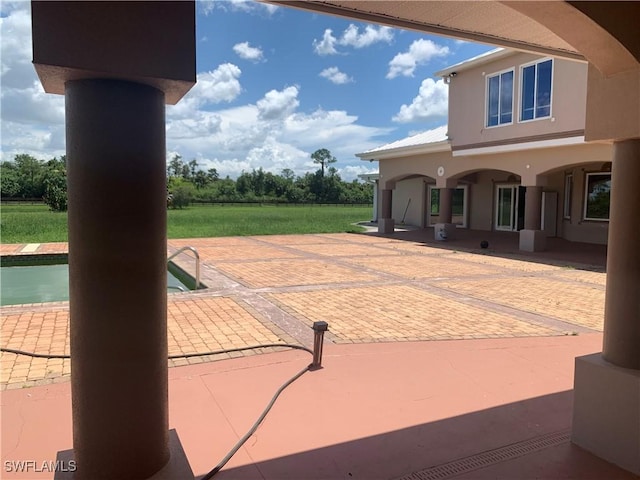 view of patio with an outdoor pool