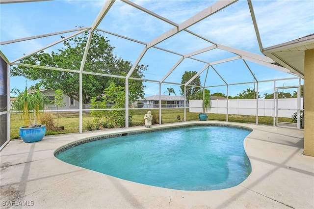 pool featuring a yard, fence, and a patio