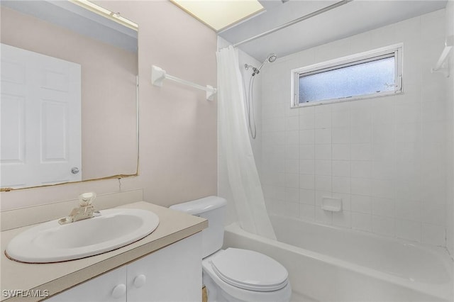 bathroom with toilet, shower / bath combination with curtain, and vanity