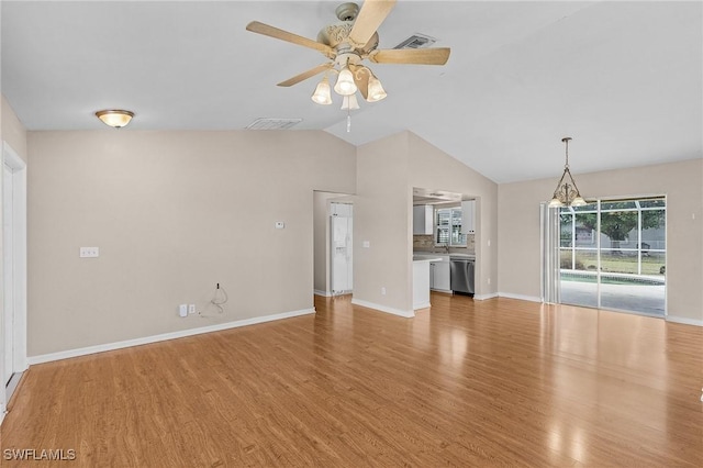 unfurnished living room with lofted ceiling, visible vents, light wood-style flooring, a ceiling fan, and baseboards