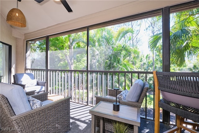 sunroom featuring ceiling fan