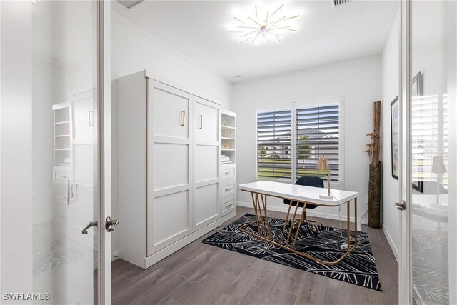 office space featuring french doors, wood finished floors, visible vents, and baseboards