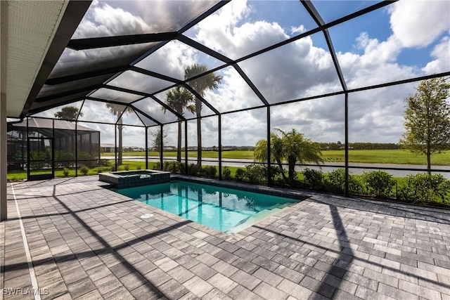 view of swimming pool featuring a patio, glass enclosure, and a pool with connected hot tub