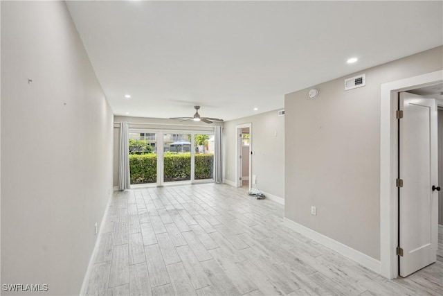 unfurnished room with ceiling fan, recessed lighting, visible vents, baseboards, and light wood-type flooring