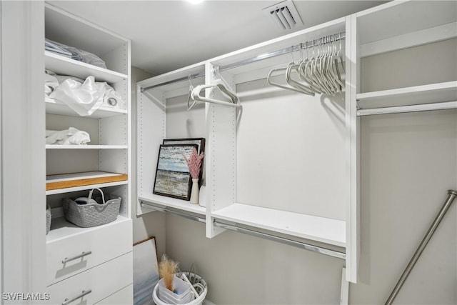 walk in closet with visible vents