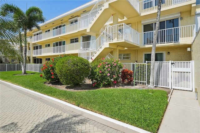 view of property with fence