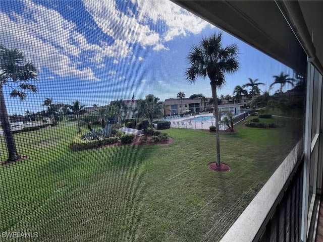 view of yard with a community pool